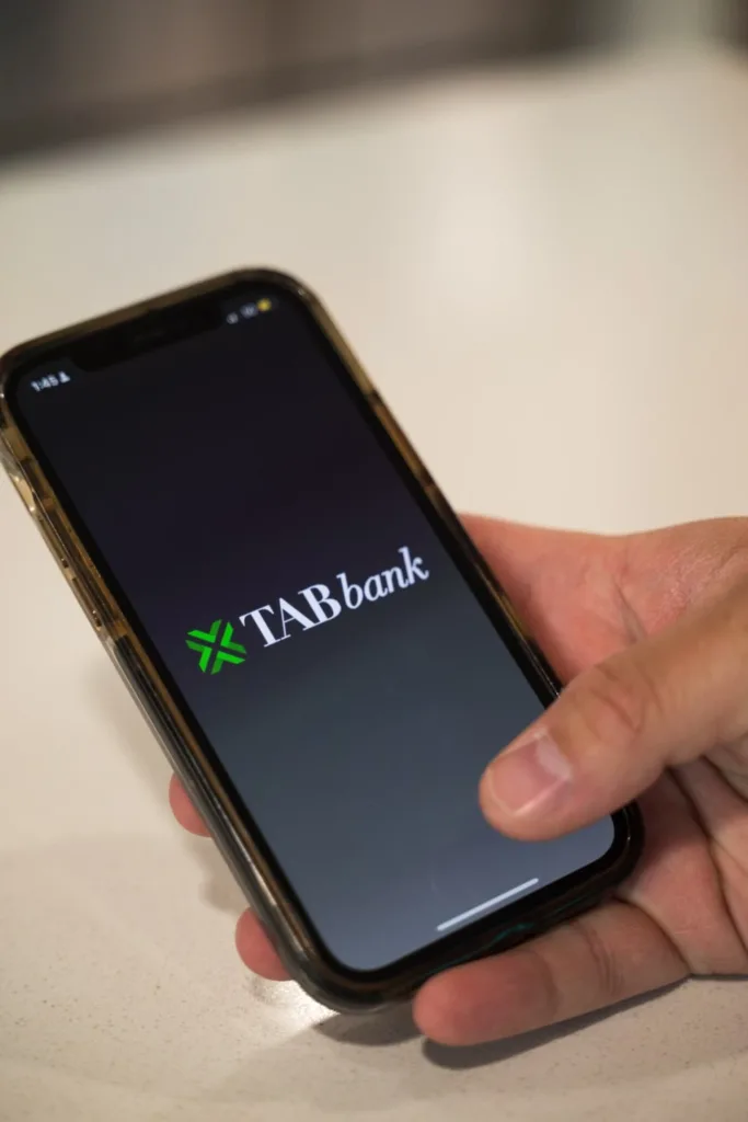 Phone in Hand "TAB Bank" on the screen